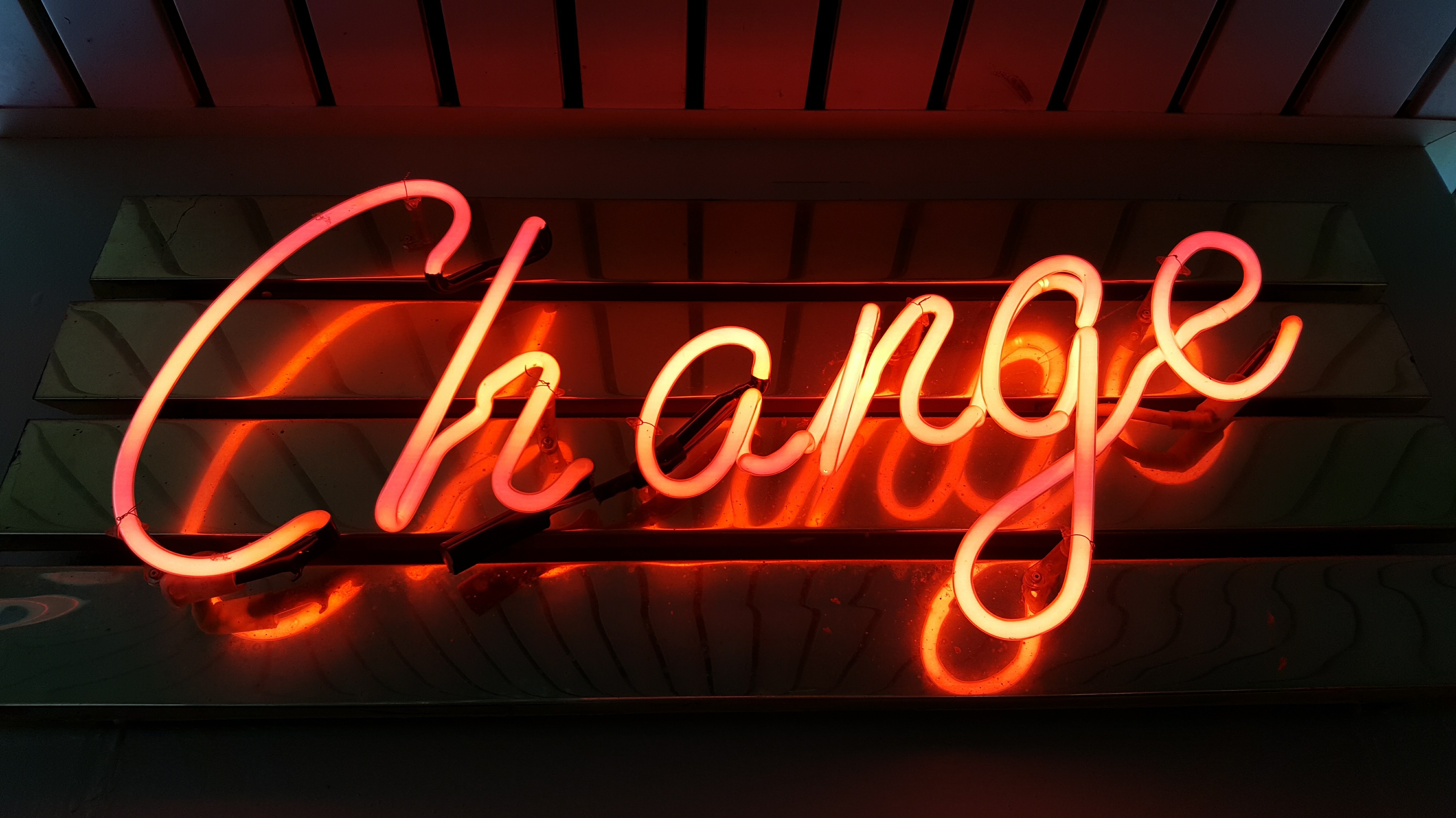 Neon sign reading “Change”